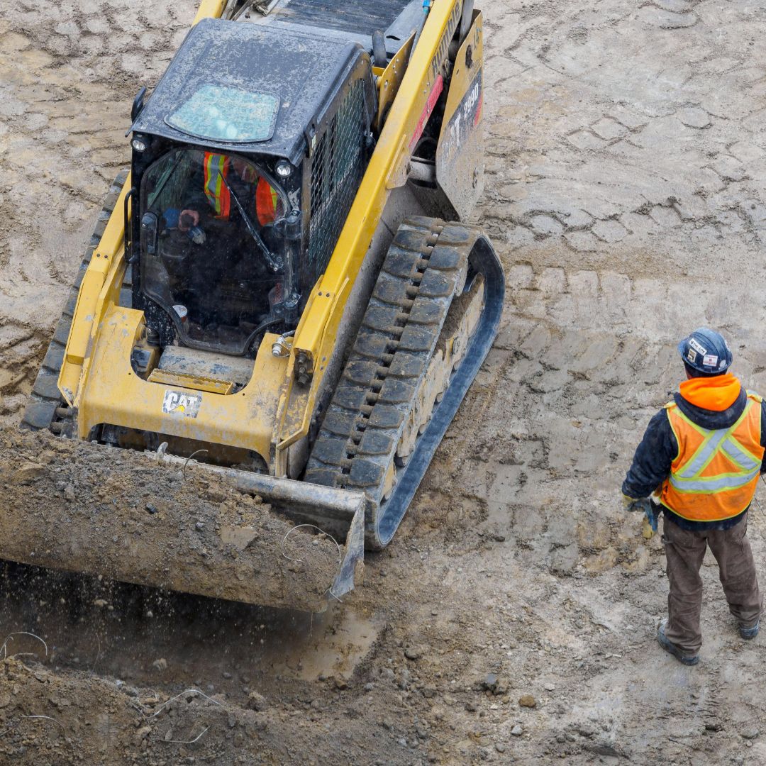 workers and bulldozer